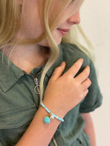 AQUA BLUE WITH POM POM AND PEARL Bracelet